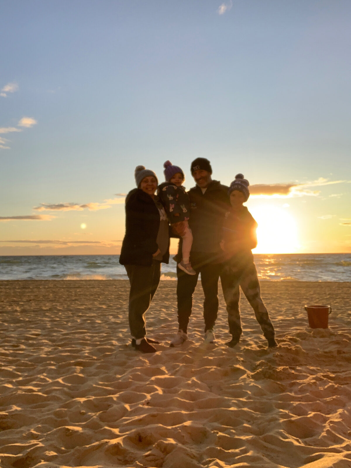 The Crockett family at the beach at sunset